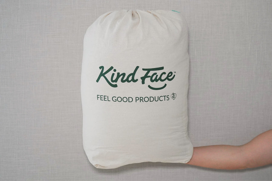 A Kind Face Cloud Wool Packaged in iIs Eco-Friendly Packaging with the Kind Face Logo Printed on it.