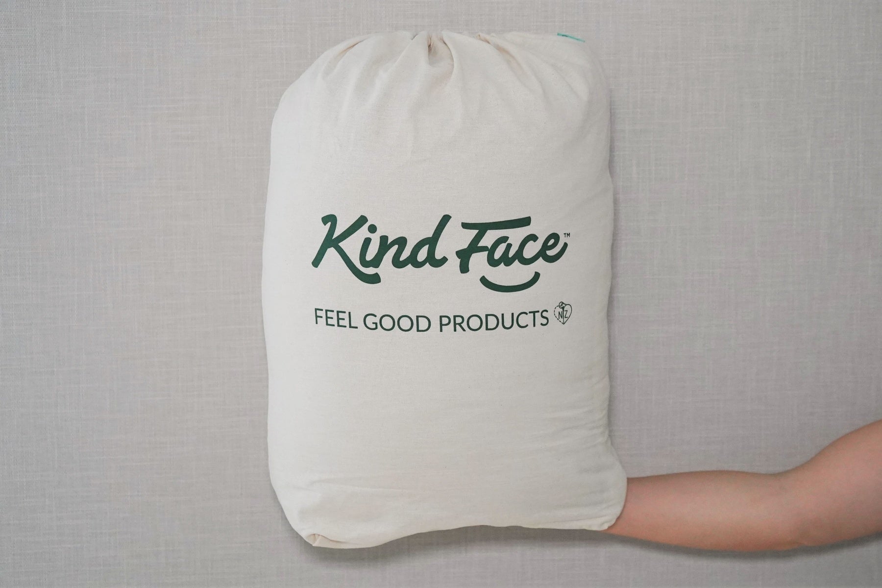 A Kind Face Cloud Wool Packaged in iIs Eco-Friendly Packaging with the Kind Face Logo Printed on it.