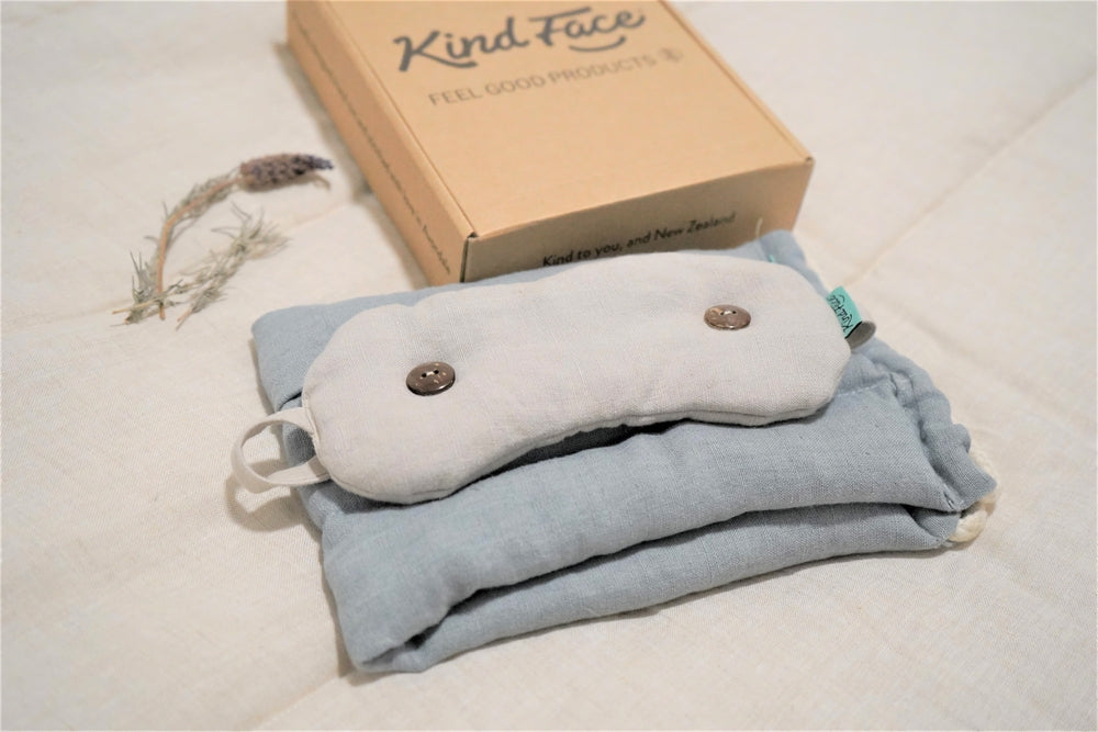 Kind Face Weighted Eye Mask and Natural Heat Pack next to a Giftbox
