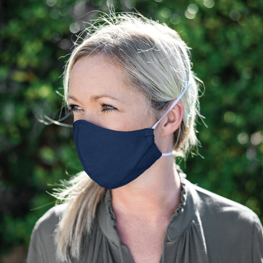 Woman Wearing a Kind Face Reusable Linen Face Mask in Navy Colour