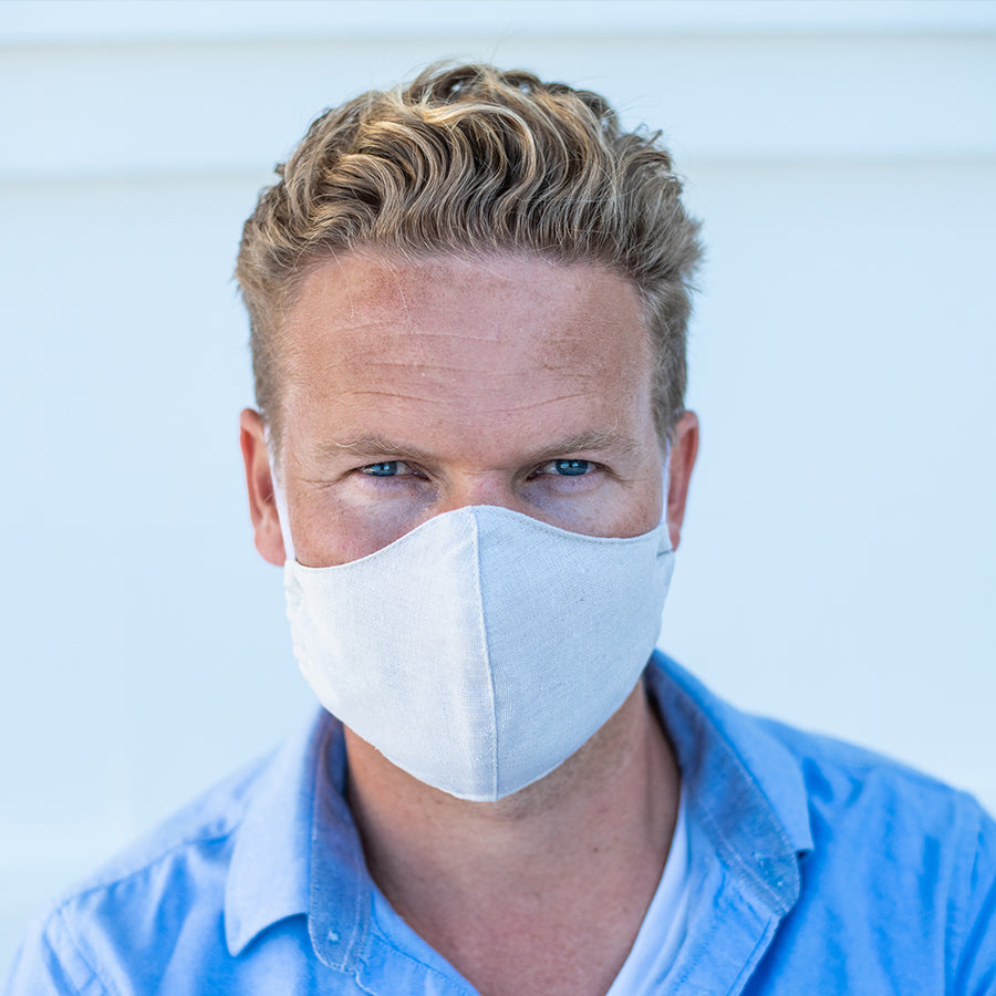 Man Wearing a Kind Face Reusable Linen Face Mask in Natural Colour