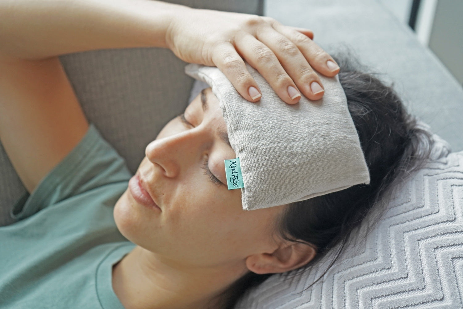 Kind Face Weighted Eye Mask in COPENHAGEN linen Kind Face_Weighted Eye Pillow_Lifestyle-Relieving a headache-BLUSH linen.jpg__PID:3954ab1d-038b-41a2-9f88-a34abd59379f
